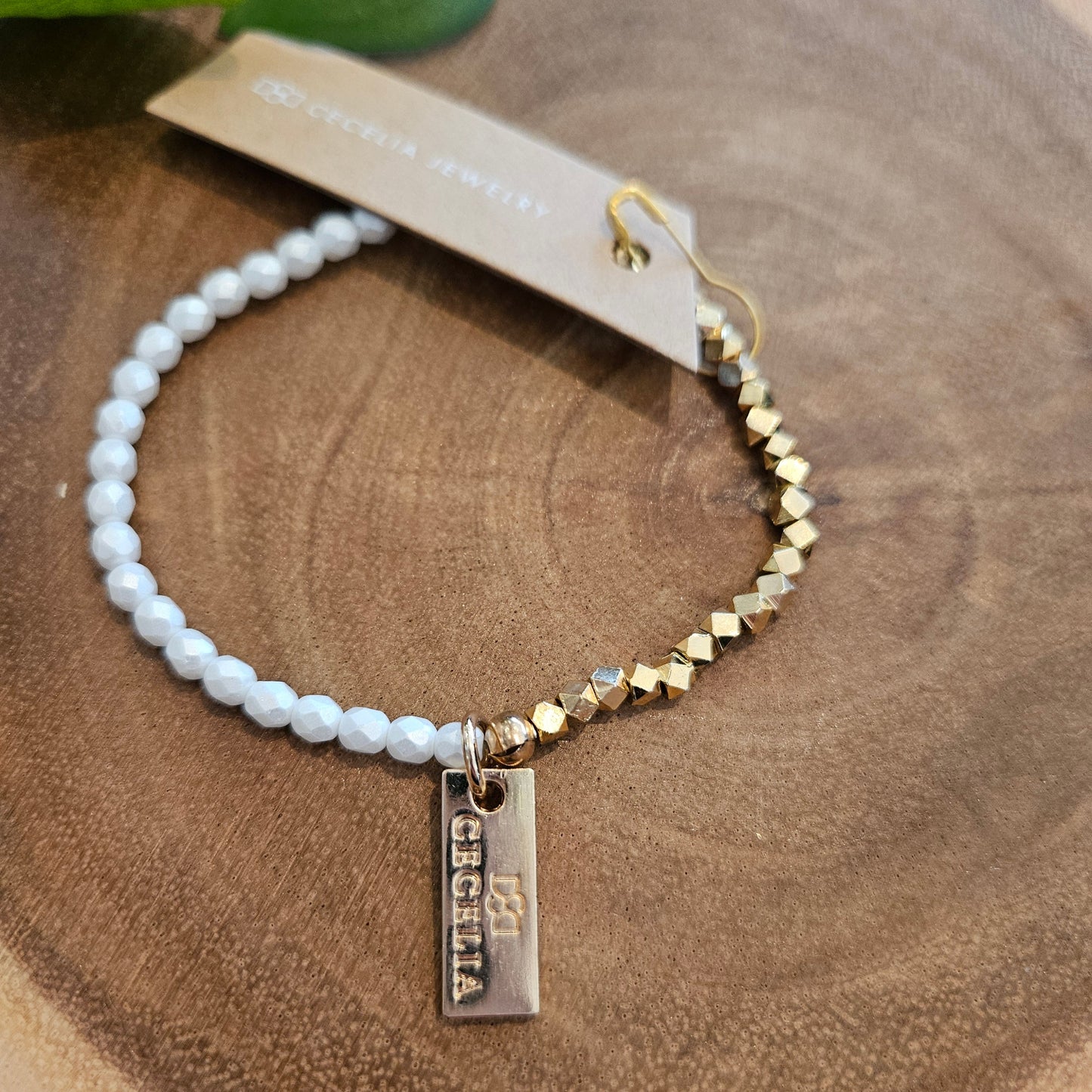 White faceted bead and Gold Bracelet